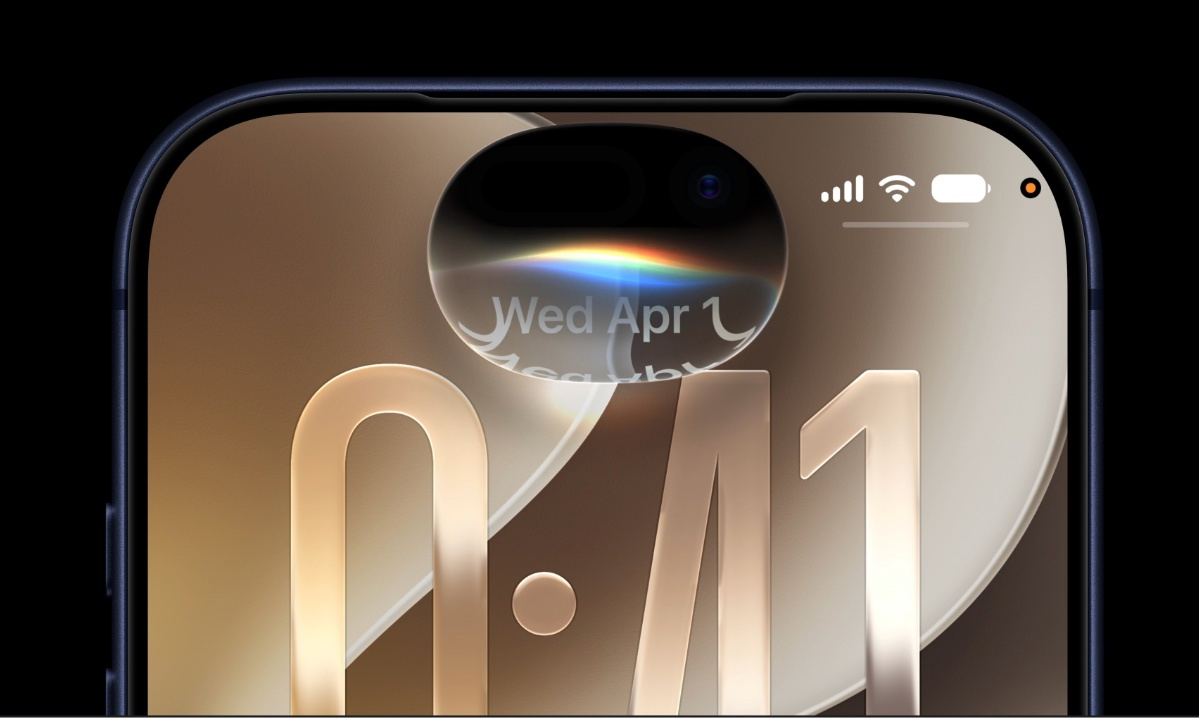 Detail Dynamic Islandu na iPhonu s duhovým světelným efektem, kterým dává Siri AI v iOS 27 najevo, že poslouchá